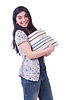 Alumna con libros | Foto de stock