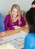 Group of smiling students with blueprint | Stock Foto