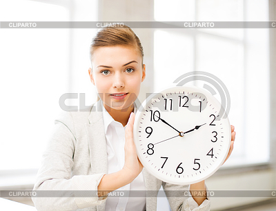 Atractiva mujer de negocios que muestra el reloj blanco | Foto de alta resolución |ID 3931808