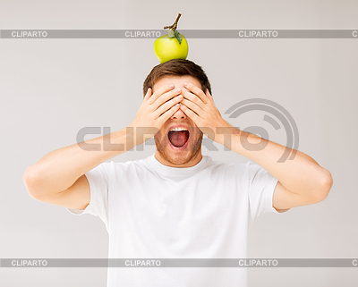 Man with green apple on his head | High resolution stock photo |ID 3931949