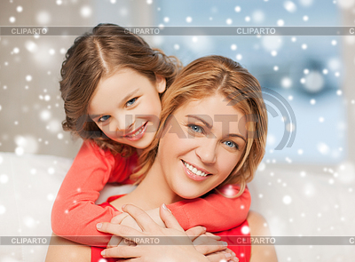 Happy mother and daughter hugging at home | High resolution stock photo |ID 4599404