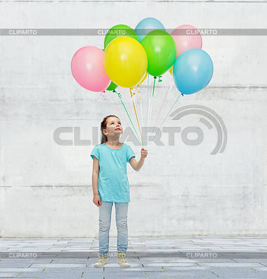 Girl looking up with bunch of helium balloons | High resolution stock photo |ID 5657616