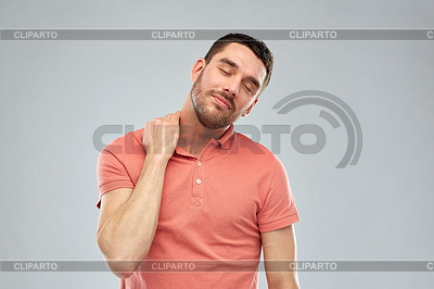 Unhappy man suffering of neck pain | High resolution stock photo |ID 5734793