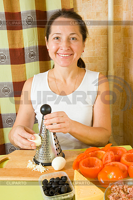 Woman grating eggs | High resolution stock photo |ID 3991832