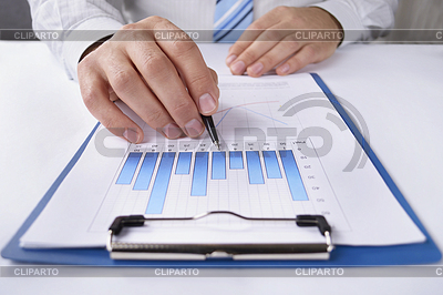 Businessman working at his desk on graph | High resolution stock photo |ID 4034731