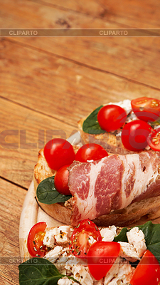 Italian appetizer. Bruschetta on wooden board on | High resolution stock photo |ID 7177739