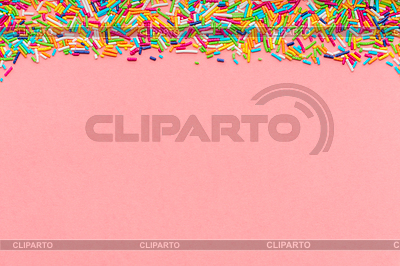 Greeting card of colorful sprinkles over pink | High resolution stock photo |ID 6791074